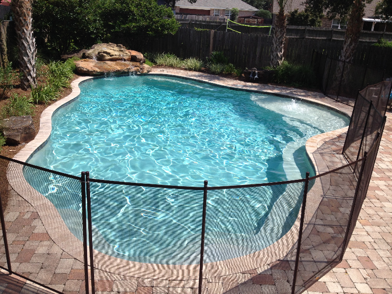Gunite pool with safety barrier